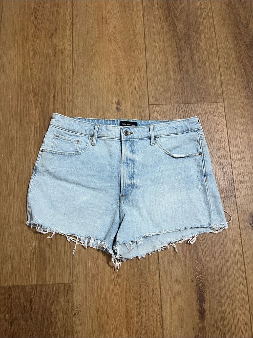 Light Blue Distressed Denim Shorts with Frayed Hem